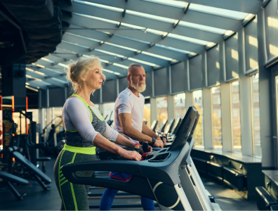 Bespoke Fitness Holiday – Personal Training in gym Woman exercising with a male personal trainer during a gym fitness session on a bespoke fitness holiday