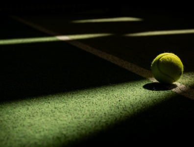 Tennis Holiday – Ready to Play on Court Tennis ball on a tennis court during a tennis holiday