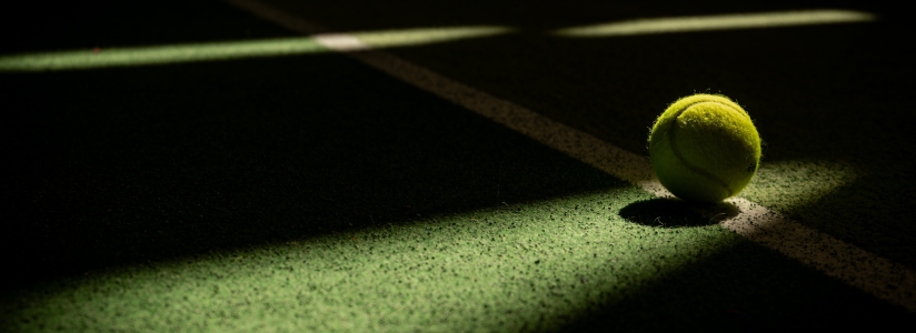 Tennis Holiday – Ready to Play on Court Tennis ball on a tennis court during a tennis holiday